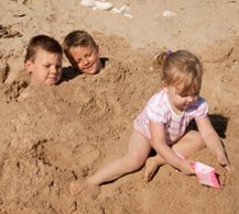 child naturism sand